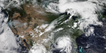 Satellite image of the Contiguous United States, with wildfires in the west, Hurricane Ida off the coast of Louisiana, and a line of thunderstorms developing over the Great Lakes region during late summer. NOAA-20 CONUS August 29 2021.png