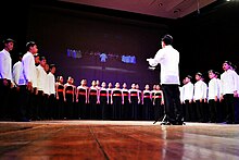 PUPLHS Chorale performing at their anniversary concert "Committed" in 2012. PUPLHS Chorale - Committed Concert 2012.jpg