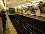 A train arrives at Corentin Celton station on Paris Métro Line 12 in September 2009