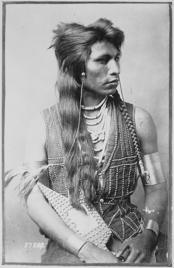 File:Rabbit-Tail, Shoshone member of Captain Ray's scout company, half-length, seated, with bracelets and ornamented vest - NARA - 530920.tif