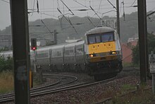 Superelevation was applied to portions of the BR network, although the angle was limited. Here, an InterCity 225, based on APT technology, rounds a canted turn on the East Coast Main Line. Railway superelevation at Dunbar, July 2012.jpg