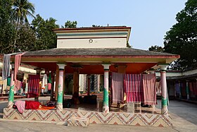 Nata-mandir in the middle of courtyard; the main roof, sloping roof and pillars are visible in the picture. Ramkeli the temporary home of Lord Sri Chaitanya 17.jpg