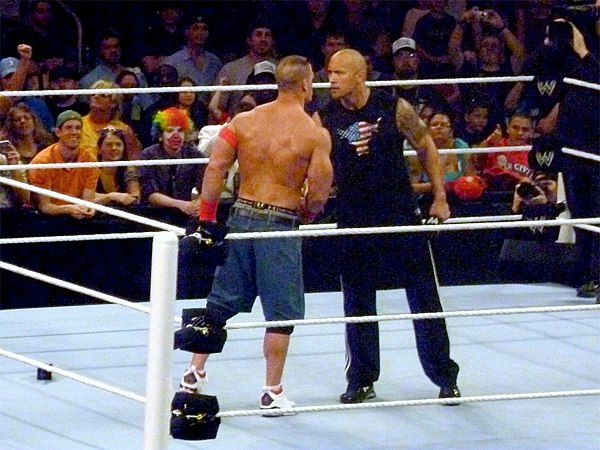 John Cena (left) and The Rock (right) agree to fight at WrestleMania XXVIII.
