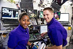 Stephanie Wilson and James Dutton in the US lab robotic workstation area