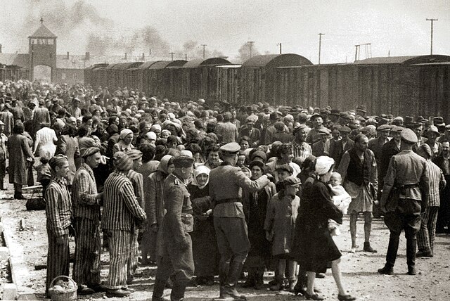 Jews arriving at Auschwitz concentration camp, 1944. According to legal historian Kirsten Sellars, the death camps "formed the moral core of the Allie