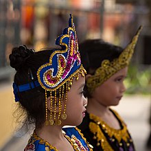 A girl in a traditional Bajau headgear Semporna Sabah Malay-girl-with-headgear-01.jpg