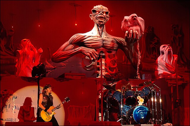 Iron Maiden's Eddie in a horror/sci-fi setting. Horror and science fiction were recurring themes in both lyrics, show scenography and cover art for NW