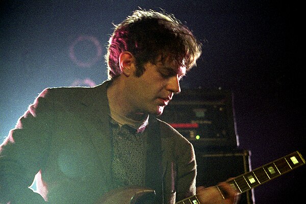 Additional guitarist Jim O'Rourke with the band in concert in 2004