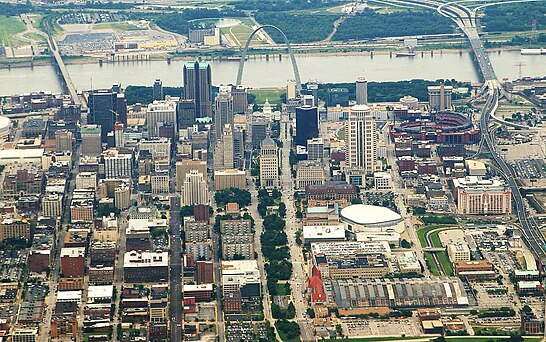 This aerial image of St. Louis, Missouri shows the urban tree canopy of the central city, and the greenspace where the Gateway Arch is located.