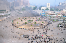 Two army vehicles burning in Tahrir Square after the army attack that happened on 9 April 2011 in the Square from 3:00 to 5:30 am; at least two protesters were killed and dozens were wounded. Tahrir Square April 9 2011.png