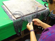 Finishing a rebozo wrap at a workshop at the Museo de Arte Popular, Mexico City. Textiles Taller 2.jpg