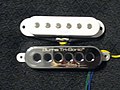 Comparison of the size between a Burns Tri-Sonic Brian May pickup, and a standard Stratocaster style pickup