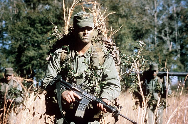 The U.S. Army Ranger in the foreground is armed with an M-16 A1 carbine (Model 653).