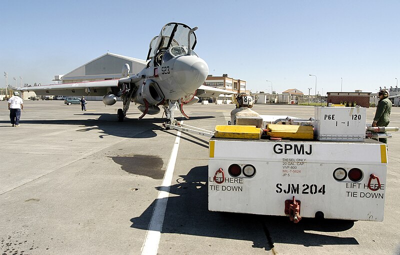 File:US Navy 030313-N-9693M-005 Members assigned to the "Gray Wolves" of Electronic Attack Squadron One Four Two (VAQ-142) maneuver an EA-6B Prowler into position for a maintenance check.jpg