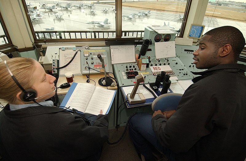 File:US Navy 050329-N-9849W-001 Air Traffic Controller 2nd Class Kathy L. Kerr, left, conducts on-the-job training to get Airman Phillip T. Hill up to speed at the Naval Air Facility Atsugi Air Traffic Control Tower.jpg