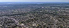 Aerial view of Valley Stream (foreground) and more of Nassau County, New York, including the Belt Parkway (left), Southern State Parkway (right), and Cross Island Parkway (center rear) Valley Stream NY and parkways.jpg