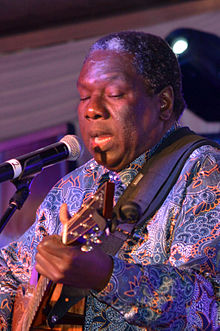 Vusi Mahlasela performing at the 100th birthday celebrations of Die Burger in Cape Town, 2015. Vusi Mahlasela 2015.jpg