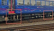 Unlike most rolling stock on the UK network, Class 143s have a single axle at each end of the vehicle (red boxes). 143axles.jpg