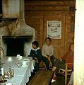 1960. Interior of the old Steibergdalshytten seen from the living room with the open fireplace, unchanged since 1895 when the cabin was erected. The door leads into one of the two bedrooms.