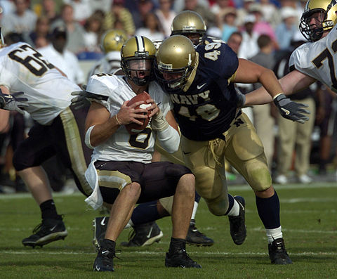 Cutler being sacked by Navy linebacker Jeremy Chase
