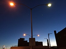 Lamppost with two street lights using high pressure sodium vapor lamp (Left) and mercury vapor lamp (Right) in Elko, Nevada (2015) 2015-02-13 17 39 16 Street light post with both sodium vapor and mercury vapor lights in the Roy's parking lot in Elko, Nevada.JPG