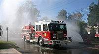 Great River Fire Department's first due engine being wetdown. 392wetdown.jpg