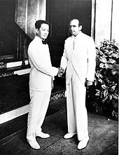 Douglas Fairbanks (right) shortly after his cruise on Belgenland, meeting the former President of the Philippines Emilio Aguinaldo (left) in March 1931 Aguinaldo and Fairbanks.jpg