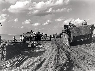 A column of "Alligator" amphibious vehicles passing Terrapin amphibious vehicles (to the left) during the Battle of the Scheldt, 13 October 1944. Alligator amphibious vehicles passing Terrepin amphibious vehicles (to the left) during the Battle of the Scheldt - October 13, 1944.jpg