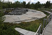 English: Rock art in the world heritage area in Alta, Norway. This is from the area Bergbukten 3a, a group of some 40 figures. 18-20 m above sea level, and 5000-6000 years old.