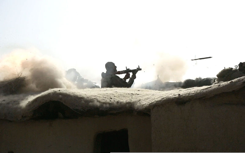 File:An Afghan National Army commando with the 3rd Company, 3rd Special Operations Kandak fires a rocket-propelled grenade launcher from the roof of a compound toward an identified enemy fighting position during 140101-A-LW390-268.jpg