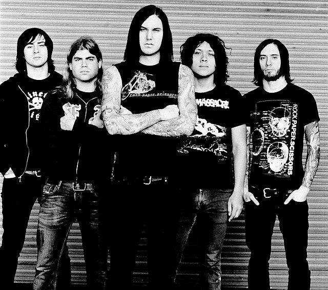 As I Lay Dying in 2006. From left to right: Phil Sgrosso, Jordan Mancino, Tim Lambesis, Nick Hipa, and Clint Norris.