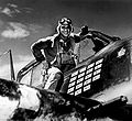 Lt Butch O'Hare seated in the cockpit of his Grumman F4F "Wildcat" fighter in Spring 1942. The plane is marked with five Japanese flags, representing the five enemy bombers he was credited with shooting down. He was the Navy's first flying ace and Medal of Honor recipient in World War II and the O'Hare airport in Chicago is named in his honor.