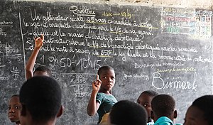 School children during a lecture in Togo Can I play too%3F.jpg