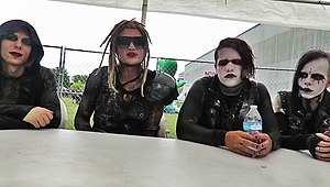 Davey Suicide (in sunglasses) and his band members