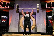 DEREK POUNDSTONE
Pressing the Apollon's Axle overhead at the 2008 Arnold Strongman Classic DerekApollon.JPG