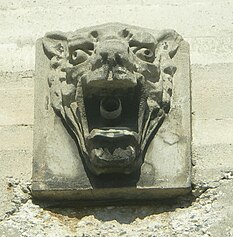 Dozens of these decorative faces adorn the exterior of Municipal Warehouse No. 1 Exterior decoration on Municipal Warehouse No. 1, San Pedro.jpg