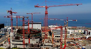 EDF has said its third-generation Flamanville 3 project (seen here in 2010) will be delayed until 2018, due to "both structural and economic reasons," and the project's total cost had climbed to EUR 11 billion by 2012. In 2019, the start-up was once again pushed back, making it unlikely it could be started before the end of 2022. In July 2020, the French Court of Audit estimated the cost will reach EUR19.1 billion, more than 5 times the original cost estimate. The initial low cost forecasts for these megaprojects exhibited "optimism bias". Flamanville-3 2010-07-15.jpg