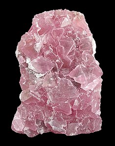 Fluorite : Amas globulaire rose à facettes cristallines