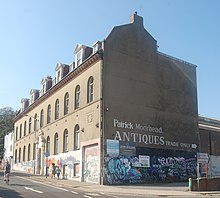 This former drill hall became Brighton's main postal delivery office. Former Drill Hall, 76 Church Street, North Laine, Brighton (NHLE Code 1380394) (August 2019).JPG