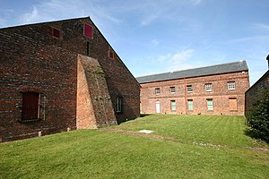 Former gunpowder magazine at Priddy's Hard, dating from 1771: "A" Magazine (left), and beyond it the south part of "B" Magazine (dating from 1773 and originally built as a cooperage). Former gunpowder magazines, Priddys Hard, Gosport (geograph 4431408).jpg