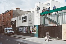 Irish police arriving outside a squat in Grangegorman in 2015, as residents look on. Guards arrive at Grangegorman squat.jpg