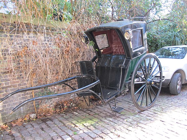 Hansom cab, showing low easy entry, trap door on top, and folding doors to protect passengers from weather and mud