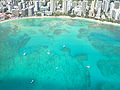 Aerial view of Honolulu (with blue waters of Waikiki Beach)