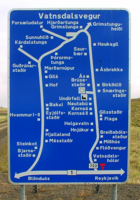 An Icelandic road sign, with detailed directions to nearby farmsteads.