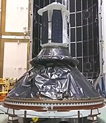 A small spacecraft being prepared for launch.