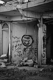 Pro-Islamic State graffiti in the ruins of Sinjar in July 2019 Islamic State graffiti in the ruins of Sinjar in July of 2019, following war with the Islamic State 18.jpg