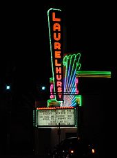 The theater's colorful neon sign and marquee, in 2002 Laurelhurst Theater neon sign - side view at night.jpg