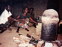 Lotoko being made from maize, in a still improvised from an oil drum. - Democratic Republic of Congo Lotoko still by Francis Hannaway.jpg