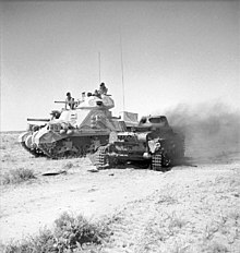 A M3 Grant next to a destroyed Panzer I, during the fighting at Gazala M3 Grant with knocked out Panzer I 1942.jpg