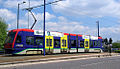 Sideways view of tram 06 in original livery.